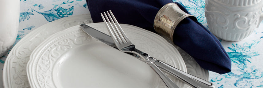 Embossed designs of fluted bands, floral scrolls, and baroque scallops on white earthenware pieces give American Countryside dinnerware a look that is elegant and sophisticated.